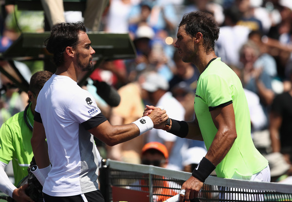 Rafael Nadal skakes hands with Fabio Fognini at the net.